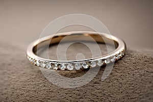 stunning close up shot of a single wedding rings, delicately intertwined to symbolize the everlasting bond of love and commitment