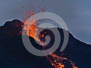 Stunning closeup view of erupting volcano in Geldingadalir valley near Fagradalsfall mountain, GrindavÃÂ­k, Reykjanes, Iceland. photo