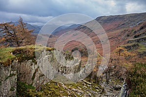 Stunning colorful Autumn landscape image of view from Castle Crag towards High Stile and Glaramara in Lake District