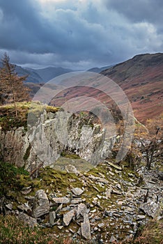 Stunning colorful Autumn landscape image of view from Castle Crag towards High Stile and Glaramara in Lake District