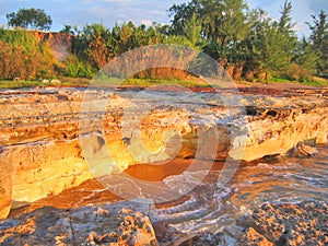 The stunning colorful cliffs of Nightcliff at the early sunset light. Darwin, NT Australia.