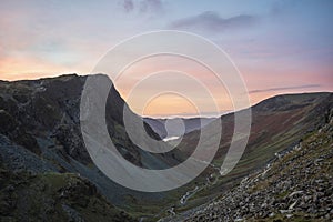 Stunning colorful landscape image of view down Honister Pass to Buttermere from Dale Head in Lake District during Autumn sunset