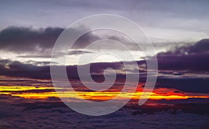 Stunning Colorful Sunset Above The Clouds Over Mountain Peaks