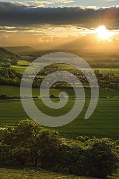 Stunning countryside landscape with sun beams