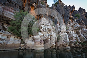 Stunning Devonian limestone cliffs of Geikie Gorge reflected in the Fitzroy River
