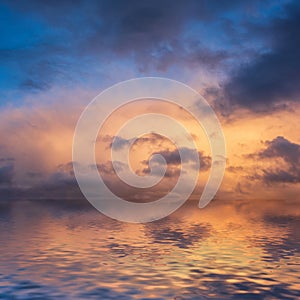 Stunning dramatic colorful stormy landscape sunset sky with lovely moody contrast in the clouds