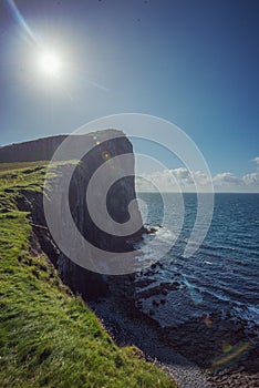 Stunning dusk cliff at Neist point lighthouse in Isle of Skye, Scotland, UK