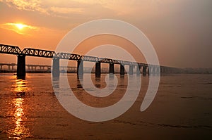 Stunning endless bridge sunset at Allahabad city photo