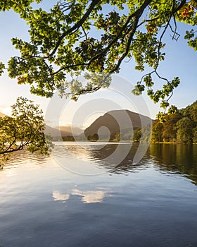 Stunning epic sunrise landscape image looking along Loweswater towards wonderful light on Grasmoor and Mellbreak mountains in Lkae photo