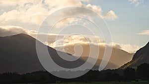 Stunning epic sunrise landscape image looking along Loweswater towards wonderful light on Grasmoor and Mellbreak mountains in Lkae photo