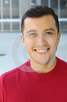 Stunning ethnically ambiguous male with blue eyes photo