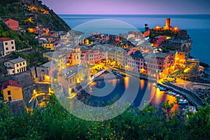 Stunning fishing village with colorful houses at evening, Vernazza, Italy