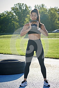 Stunning fitness model work out on track outside