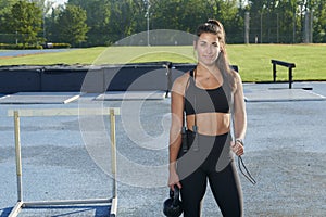 Stunning fitness model work out on track outside