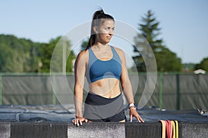 Stunning fitness model work out on track outside