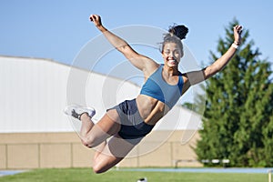 Stunning fitness model work out on track outside