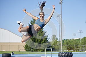 Stunning fitness model work out on track outside