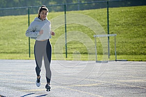 Stunning fitness model work out on track outside