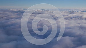 Stunning footage of aerial view above clouds from airplane