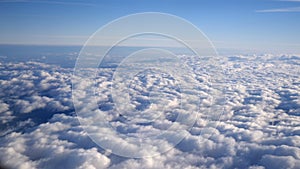 Stunning footage of aerial view above clouds from airplane