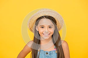 Stunning girl in elegant hat. Cheerful face. Emotional child. Summer holidays. Fashionably dressed. Enjoying vacation