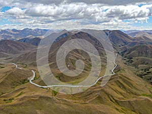 Stunning high angle aerial drone view of Highway 8 at Lindis pass elevation 971 m, a mountain pass