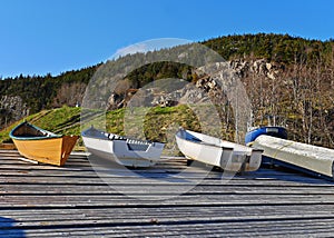 Stunning image of boats pulled ashore on wharf in summer