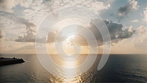 Serene Ocean Sunset with Clouds