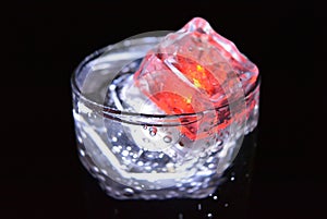 Stunning images of drinks with glowing ice cubes.  Bright colors with bubbles in a glass of champagne.