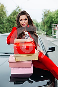 Stunning lady with stack of shoe boxes.