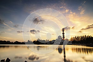 Stunning landscape floating mosque at Terengganu, Malaysia over golden sunset background