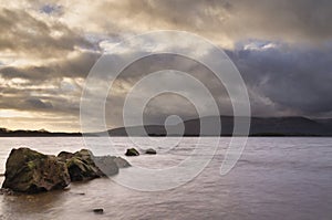 Stunning landscape image of Milarrochy Bay on Loch Lomond in Scottish Highlands with stunning Winter evening ligh photo