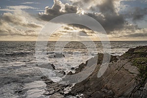 Stunning landscape image of view from Hartland Quay in Devon England durinbg moody Spring sunset