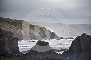 Stunning landscape image of view from Hartland Quay in Devon England durinbg moody Spring sunset