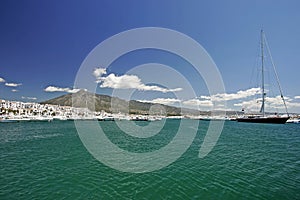 Stunning landscape views across clear waters of port or harbour in Spain