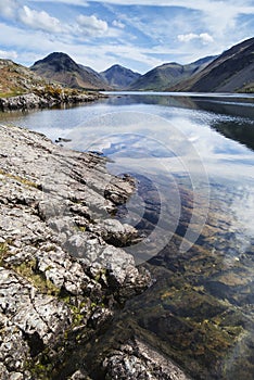 Stunning landscape of Wast Water with reflections in calm lake w