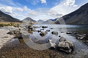 Stunning landscape of Wast Water with reflections in calm lake w