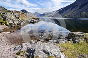 Stunning landscape of Wast Water with reflections in calm lake w photo