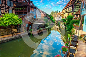 Stunning medieval colorful facades reflecting in water, Colmar, France, Europe