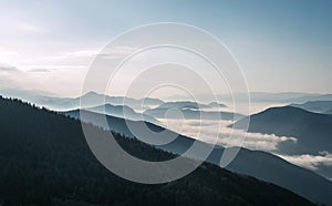 Stunning morning landscape view of the fog river flowing by the valley between the mountains. Mala Fatra mountains, Slovak