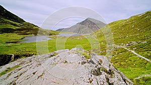 Stunning natural mountain landscape scenery of Cwm Idwal Lake in Glyderau range of Snowdonia Nation