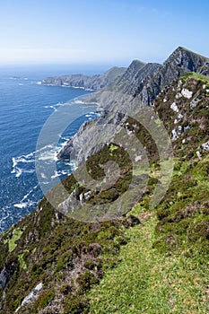 Stunning nature scene of Achill island, county Mayo, Ireland. Green hills and blue sky and ocean surface. Irish landscape. Warm