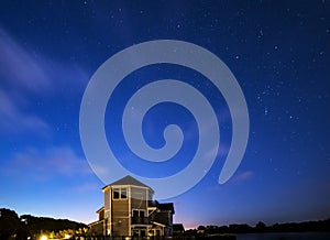 Stunning night sky astrophotography landscape image of stars over still lake