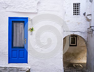 Stunning old blue door on typical white house, Ostuni, Apulia region, southern Italy