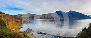 Stunning panorama view of Lake Thun from Spiez with Swiss Alps Sigriswiler Rothorn and  Niederhorn in background on a sunny autumn