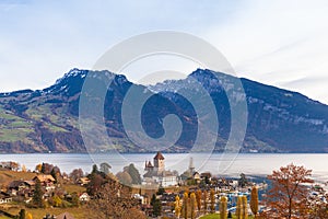 Stunning panorama view of Spiez town and Lake Thun with Swiss Alps Sigriswiler Rothorn and  Niederhorn in background on a sunny