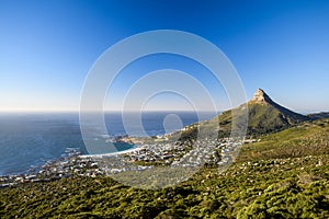 Stunning panorama view of the suburb of Camps Bay and Lion`s Head mountain in Cape Town