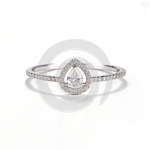 Delicate Pear Shaped Diamond Ring In High-key Lighting