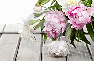 Stunning peonies in white wicker basket