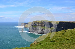 Stunning photo of the grassy tops of the Cliffs of Moher photo